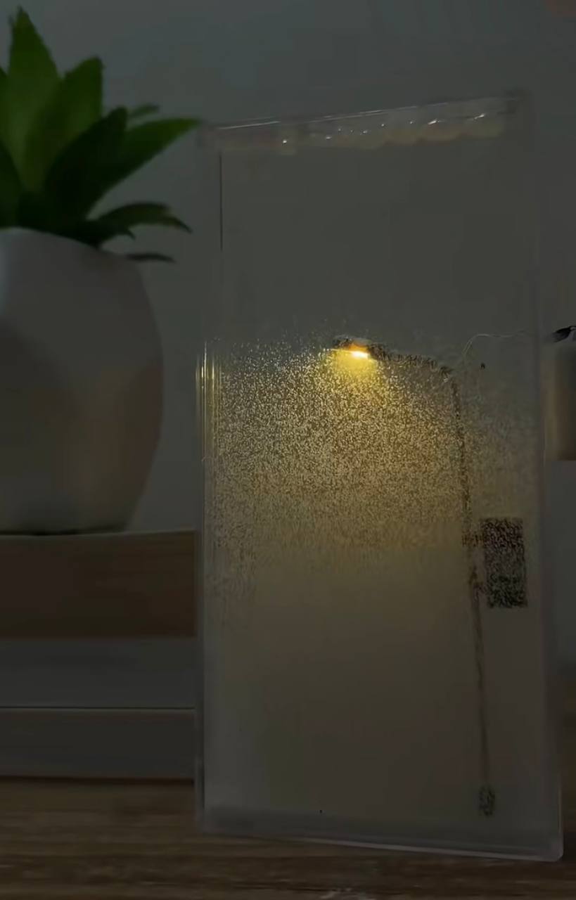 The "City Under Snow" Lightbox is a decorative LED lamp with a snowfall effect