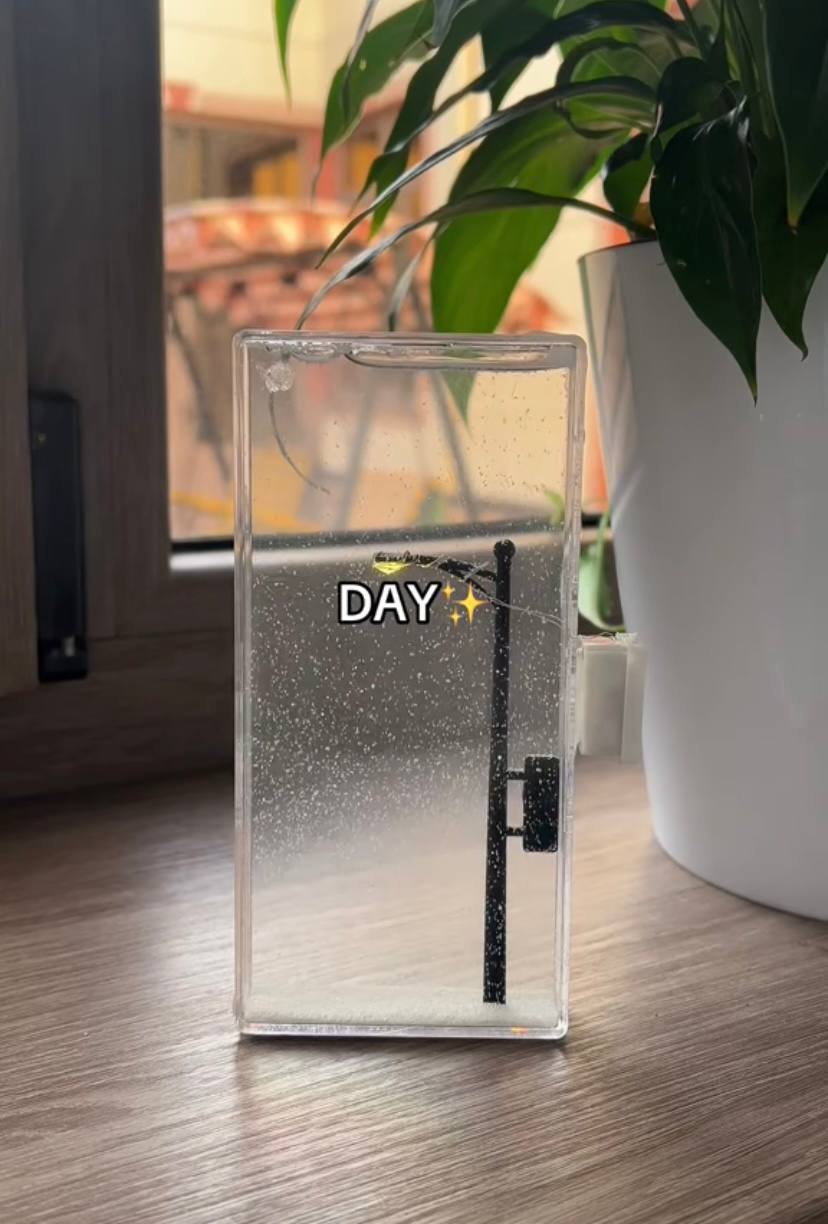 The "City Under Snow" Lightbox is a decorative LED lamp with a snowfall effect