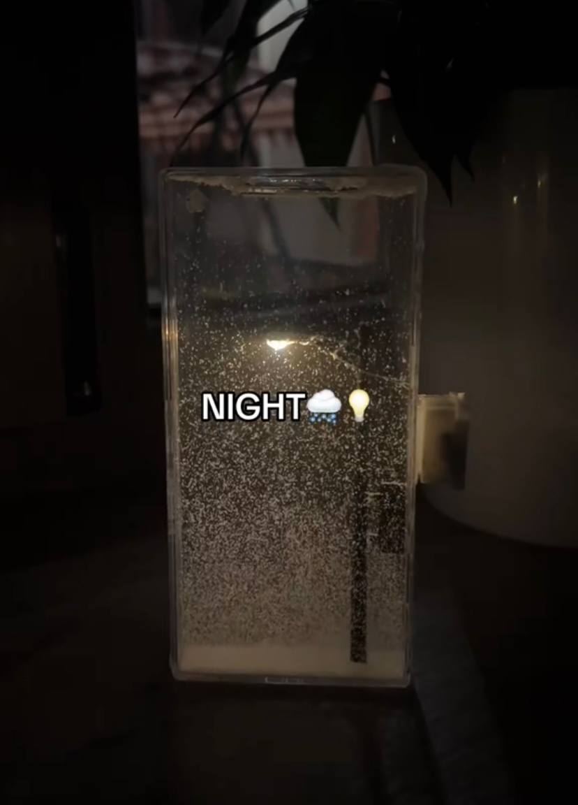 The "City Under Snow" Lightbox is a decorative LED lamp with a snowfall effect